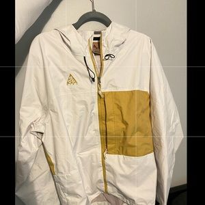 white and gold bike wind breaker